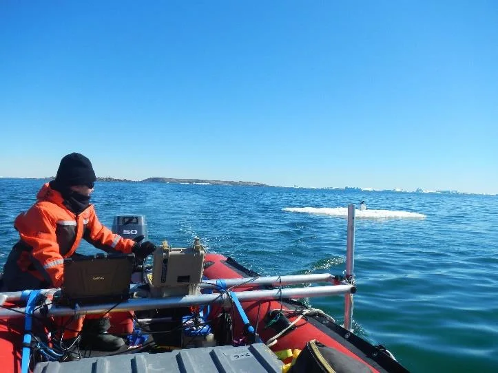 Surveyor operating the CEESCOPE tactical kit and HYPACK acquisition on an inflatable boat