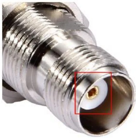 Close-up of a TNC antenna connector with the centre contact highlighted