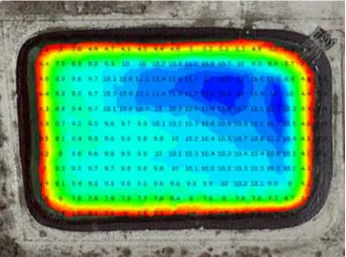 Colour-coded bathymetric map of a rectangular frac pit with depth values