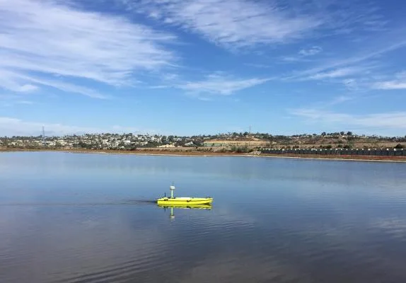CEE-USV surveying on the lagoon with the shoreline in the distance