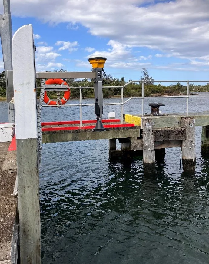 VEGA radar probe and Trimble GNSS antenna on a pier at Bullock Island