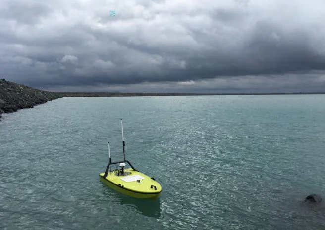 Yellow CEE-USV on the water with long-range antennae