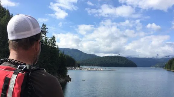 Operator looking out over the lake from the shore observation point
