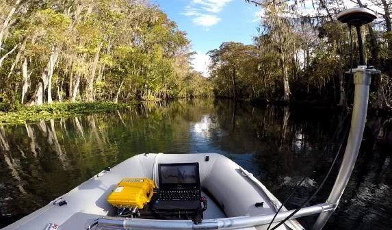 CEE ECHO case and laptop in the inflatable boat with the GNSS antenna on a pole